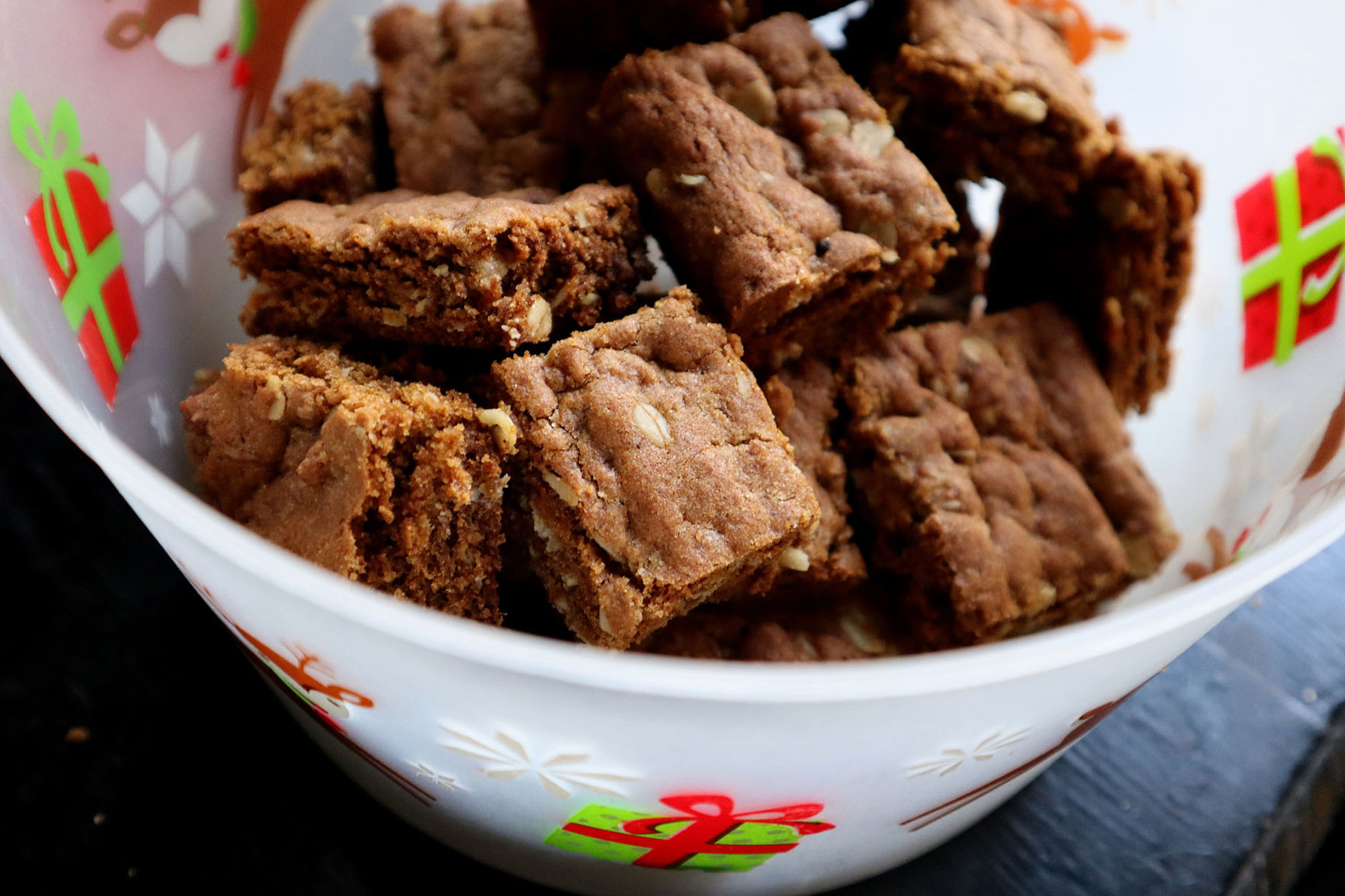 A snack that combines protein carbs and fat -- such as these ginger and molasses energy bars -- help you feel satiated when you're stress eating.